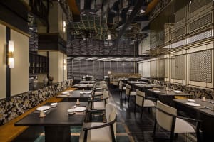 A spacious modern restaurant with multiple tables and chairs, well-lit and inviting, with a focus on functionality and comfort