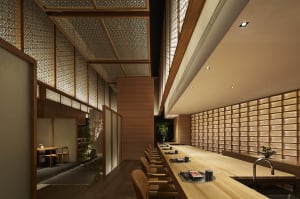 A warm and inviting restaurant dining area with a large wooden table surrounded by brown chairs, lit by soft lights