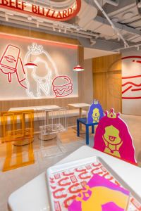 casual restaurant interior with wooden floors and walls, featuring chairs, tables, and decorative elements