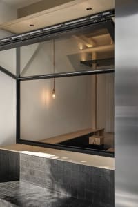Bright and inviting cafe interior with a counter, window, and two benches for seating