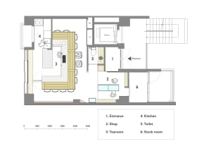 Black and white floor plan with kitchen, dining, living rooms, bedroom, and bathroom, featuring doors, windows, and staircases