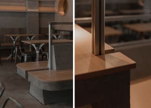 A well-lit restaurant interior with wooden countertops, dining tables, and comfortable seating, perfect for socializing and enjoying meals