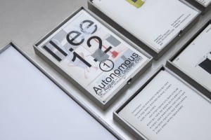 A table display of three main books and two smaller books, arranged in an organized and visually appealing manner
