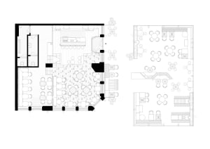 Black and white floor plan of a restaurant with various rooms, including a dining area, kitchen, and possibly a bar, with a cozy and inviting atmosphere