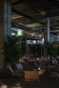 A cozy indoor space with multiple wooden chairs in various positions, creating an inviting atmosphere