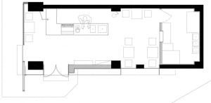 Empty minimalist room with a staircase, sink, and clean lines, suggesting a recently renovated space