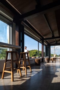 A casual living and dining space with multiple chairs and a dining table, featuring a comfortable and relaxed atmosphere