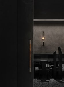 Cozy restaurant dining area with modern seating, multiple tables, and chairs
