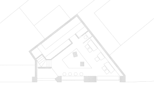 Modern open-plan living and dining space with a dining table, chairs, couches, and clean lines