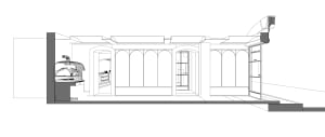Empty minimalist building with large windows, archways, and a concrete exterior