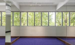 A bright and airy lobby with white walls, large windows, and natural light pouring in