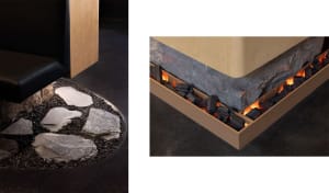 Cozy living space with a stone fireplace, wooden frame, and two views of the fireplace