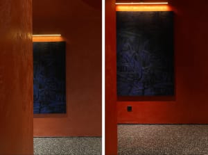 Two blue paintings on display in an art gallery with a focus on artistic and creative environment