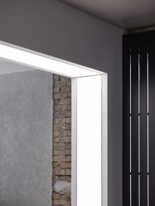 A well-lit interior view of a brick wall with a textured and rustic appearance