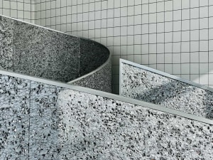 A modern staircase with concrete steps and metal railings, featuring a sleek and contemporary design
