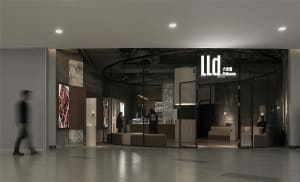 Bright and welcoming retail space with modern design, glass partitions, and TV screens on the walls