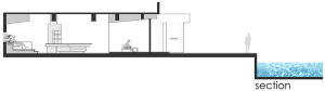 Inviting living area with two chairs, a dining table, and a kitchen nearby, featuring a comfortable and functional home atmosphere