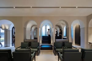 A welcoming lobby with multiple seating options, including chairs and benches, creating a comfortable atmosphere for visitors