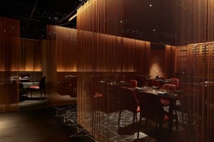 A modern restaurant with several tables and chairs, creating an inviting and comfortable atmosphere with a focus on functionality and contemporary aesthetics