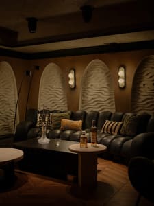 Cozy living space with a couch, chairs, dining table, and decorative elements