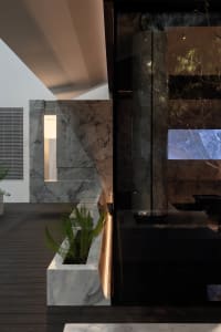 Inviting living area with natural light, potted plants, and seating options