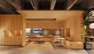 Open restaurant interior with wooden walls and floors, dining tables, chairs, and potted plants