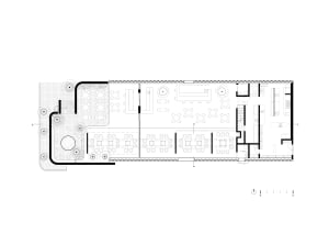 Black and white floor plan of a traditional building with a dining area and kitchen, featuring linework, labels, and measurements