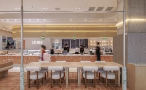 A well-lit restaurant interior with multiple tables and chairs, providing ample seating options for guests