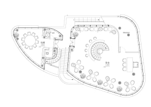2D floor plan with various rooms and spaces, featuring a mix of architectural styles and well-lit areas