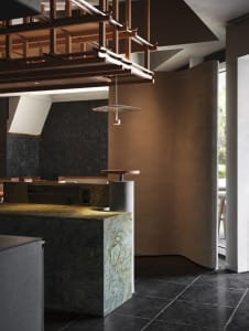 Modern restaurant dining area with a marble countertop, chairs, and a dining table, featuring warm and inviting lighting