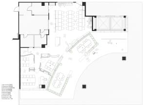 Black and white floor plan of a modern building with clean lines, minimalistic design, and large windows or skylights