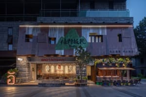 Cozy Asian restaurant with a large dining area, potted plants, and inviting atmosphere