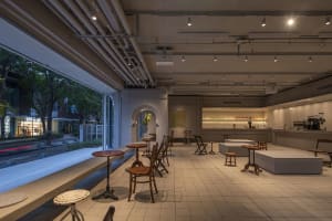 Open concept dining and kitchen space with chairs, a dining table, and a kitchen area, featuring a bright and inviting atmosphere