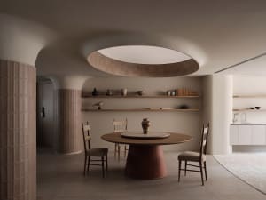 A cozy dining space with a wooden table surrounded by four chairs in a combination of brown and white colors