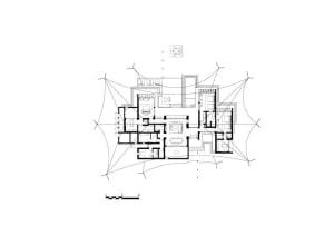 Black and white architectural drawing of a house floor plan with walls, doors, windows, staircases, and people