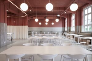 Empty restaurant with white tables and chairs, modern and traditional design elements, clean and well-organized atmosphere