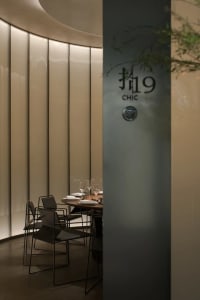 Elegant dining space with fine wine glasses, well-arranged seating, and a sophisticated atmosphere