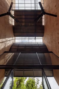 A modern open area with multiple levels of stairs, metal railings, and a focus on functionality and accessibility