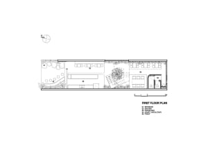 Black and white floor plan of a hotel with various rooms, including a lobby and dining area, showcasing a modern and functional design