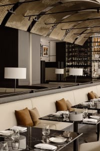 Sophisticated dining space with wooden accents, well-lit surroundings, and tasteful decorations