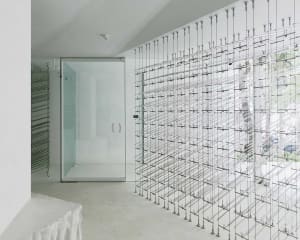 Modern bathroom with a glass shower enclosure, clean lines, and a focus on functionality
