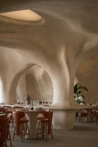 Elegant dining space with wooden furniture, wine glasses, and a comfortable atmosphere