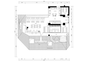 Commercial dining space with multiple tables, chairs, and sinks, featuring a modern and functional floor plan