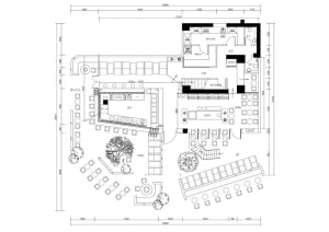 2D floor plan of a modern building with a mix of indoor and outdoor areas, featuring clean lines, concrete, glass, and metal materials