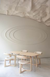 Modern restaurant dining area with wooden tables and chairs, creating a warm and inviting atmosphere