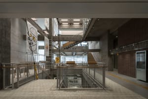 A quiet interior space with a concrete stairwell, multiple steps, and a calm atmosphere