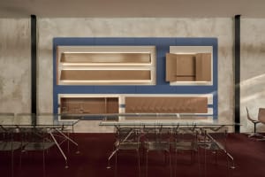 Modern dining area with a glass table surrounded by chairs in a contemporary and stylish environment