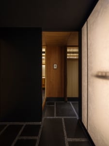 Wooden hallway with two doors, warm and cozy atmosphere, wooden walls and floors
