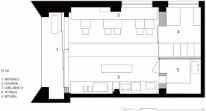 Modern interior with multiple levels, clean lines, and minimalistic design, featuring a kitchen and dining area with natural light