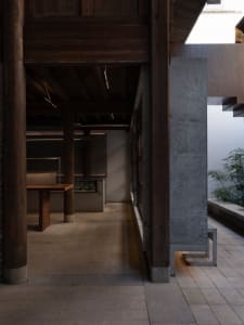 Open dining space with a wooden dining table and chairs, well-lit and inviting